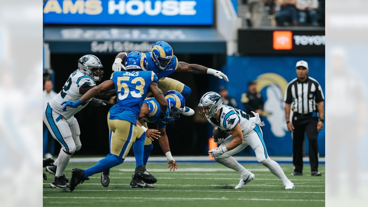 Rams Defense Swarm Christian McCaffrey Photo Credit: Panthers.Com