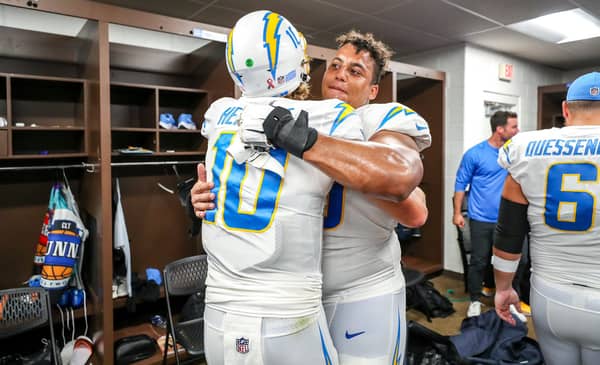 Justin Herbert and Rashawn Slater Celebrate After A Win In Washington. Photo Credit: Los Angeles Chargers On Twitter