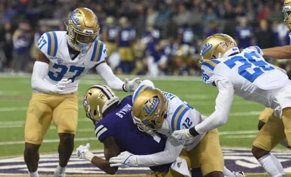 Underdog Bruins Take Bite Out Of Huskies 2 UCLA Defense Against The Washington Huskies. Photo Credit: Greg Turk | UCLA Athletics