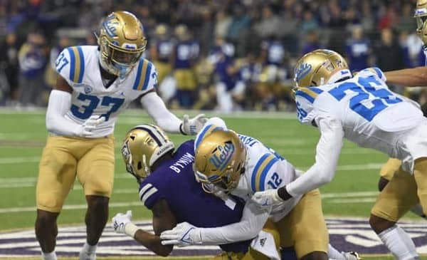 UCLA Defense Against The Washington Huskies. Photo Credit: Greg Turk | UCLA Athletics