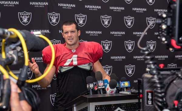 Oakland Raiders Quarterback Derek Carr speaks with the media after his practice in Napa Valley, Calif., August 7, 2018. U.S. Air Force photo by Louis Briscese via Creative Commons License.