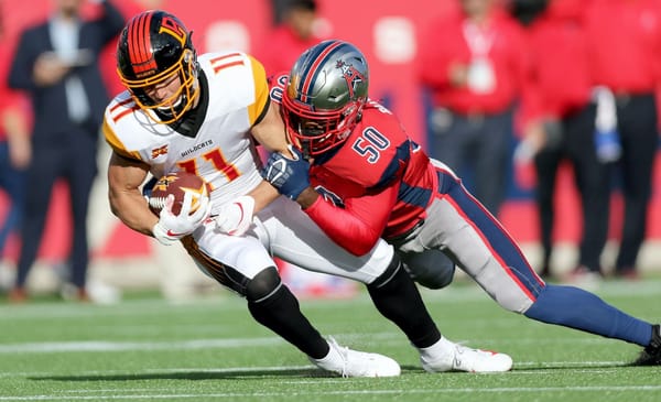HOUSTON, TX - FEBRUARY 8: LA Wildcats wide receiver Nelson Spruce (11), is tackled by Houston Roughnecks linebacker Kaelin Burnett (50) during action on February 8, 2020 at TDECU Stadium in Houston, Texas. (Photo by Michael Starghill/XFL)