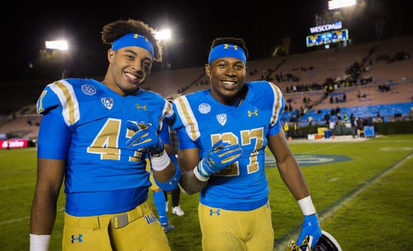 UCLA Bruins linebacker Shea Pitts (47) and running back Joshua Kelley (27) after the game against Cal; Cal at UCLA, November 30, 2019, Los Angeles, CA. Photo Credit: Steve Cheng | Under Creative Commons License