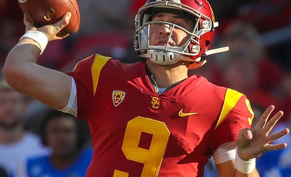 USC Trojans quarterback Kedon Slovis (9) passes to USC Trojans wide receiver Drake London (15) for a 32-yard touchdown pass in the third quarter; UCLA at USC. November 23, 2019, Los Angeles, CA. Photo Credit: Steve Cheng | Bruin Report | Creative Commons License