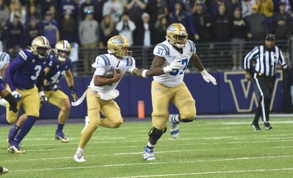 Dorian Thompson-Robinson Running Against The Washington Huskies. Photo Credit: Greg Turk | UCLA Athletics