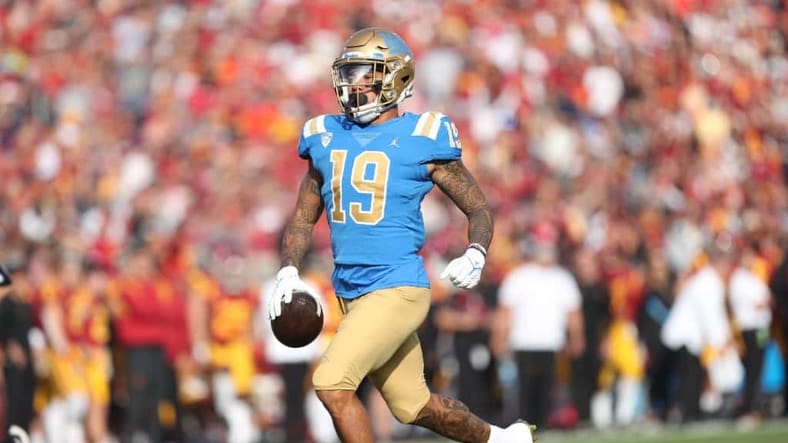 Kazmeir Allen heads into the end zone for his second TD of the afternoon in the first half against USC. Photo Credit: Jesus Ramirez | UCLA Athletics