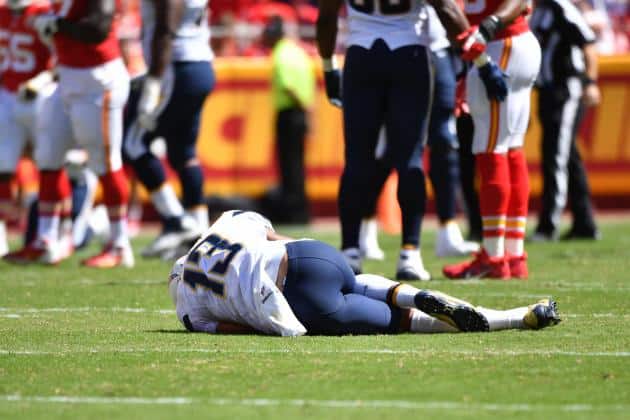 San Diego Chargers receiver Keenan Allen lies injured on the field at Arrowhead Stadium