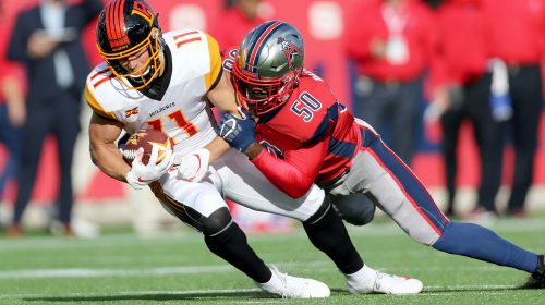 HOUSTON, TX - FEBRUARY 8: LA Wildcats wide receiver Nelson Spruce (11), is tackled by Houston Roughnecks linebacker Kaelin Burnett (50) during action on February 8, 2020 at TDECU Stadium in Houston, Texas. (Photo by Michael Starghill/XFL)