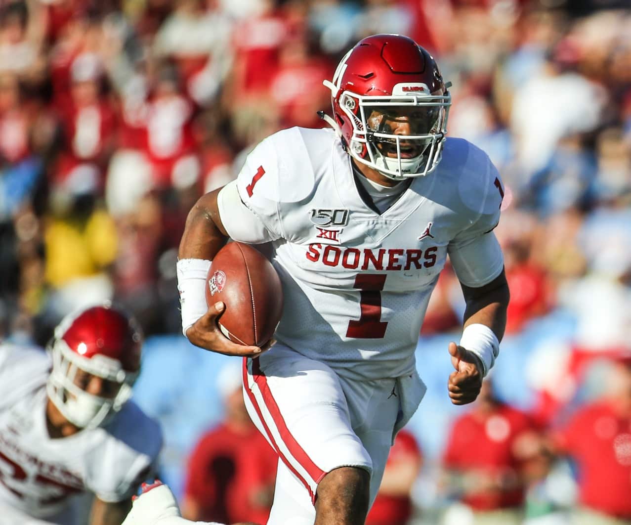 Oklahoma Sooners quarterback Jalen Hurts (1) runs for a 30-yard touchdown on 4th down and 3 to give Oklahoma a 7-0 lead in the first quarter; Oklahoma defeated UCLA 48-14, Sept 14, 2019, Pasadena, CA. Photo Credit: Steve Cheng | Under Creative Commons License