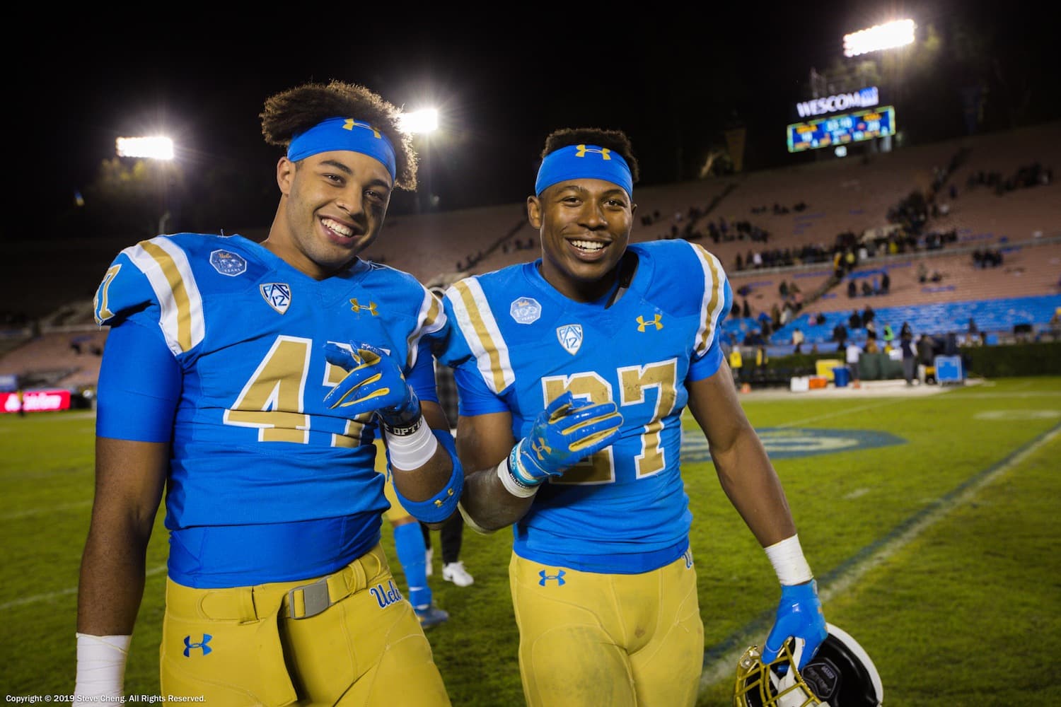 UCLA Bruins linebacker Shea Pitts (47) and running back Joshua Kelley (27) after the game against Cal; Cal at UCLA, November 30, 2019, Los Angeles, CA. Photo Credit: Steve Cheng | Under Creative Commons License