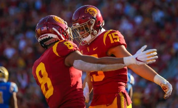 USC Trojans wide receiver Amon-Ra St. Brown (8) and Drake London celebrate after London's touchdown catch; UCLA at USC. November 23, 2019, Los Angeles, CA. Photo Credit: Steve Cheng | Under Creative Commons License
