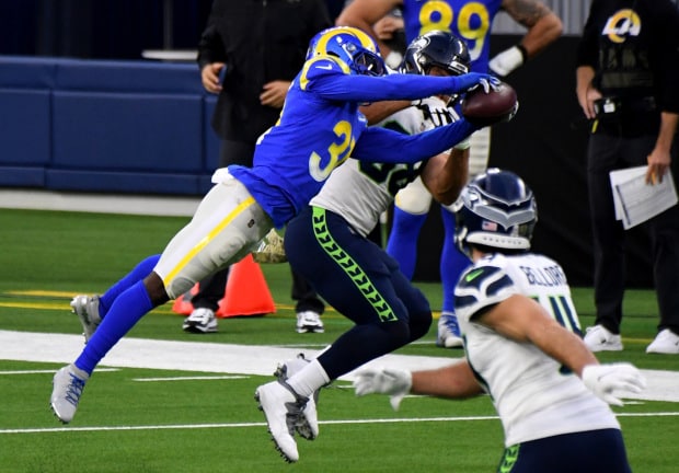 Defensive back Darious Williams #31 of the Los Angeles Rams intercept a pass intended for tight end Greg Olsen #88 of the Seattle Seahawks in the fourth quarter of a NFL football game at SoFi Stadium in Inglewood on Sunday, November 15, 2020. Los Angeles Rams won 23-16. (Photo by Keith Birmingham, Pasadena Star-News/SCNG)