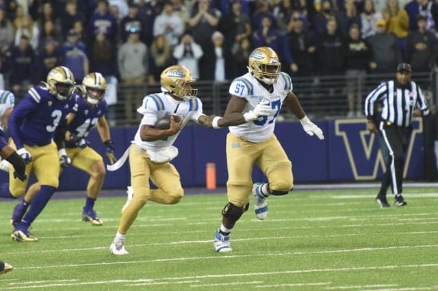 Dorian Thompson-Robinson Running Against The Washington Huskies. Photo Credit: Greg Turk | UCLA Athletics