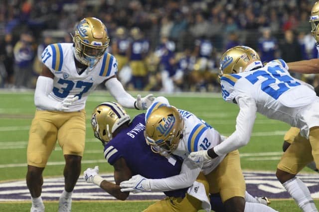 Underdog Bruins Take Bite Out Of Huskies 3 UCLA Defense Against The Washington Huskies. Photo Credit: Greg Turk | UCLA Athletics