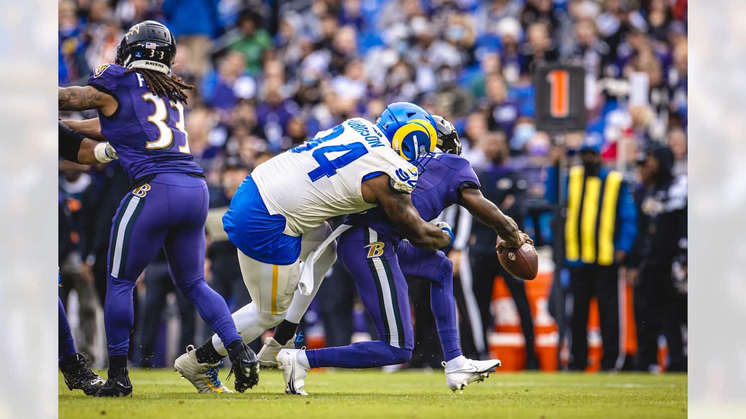 Los Angeles Rams Defensive Lineman A'Shawn Robinson Tackles Baltimore Ravens Quarterback Tyler Huntley. Photo Credit: Brevin Townsell | LA Rams