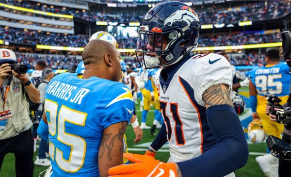 Chargers Dominate Broncos In Must-Win Game: By The Numbers 1 Los Angeles Chargers Cornerback Chris Harris Jr. And Denver Broncos Safety Justin Simmons Meet After The Game. Photo Credit: Ty Nowell | LA Chargers
