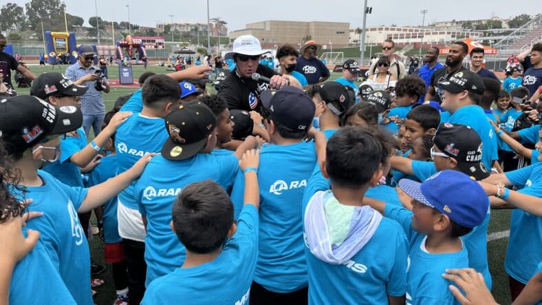 Youth Football Coach Keith McMaster Huddles Players: Photo Credit: Ryan Anderson | LAFB