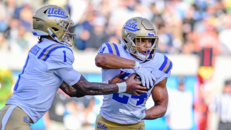 Dorian Thompson-Robinson Hands The Ball Off To Zach Charbonnet. Photo Credit: UCLA Athletics