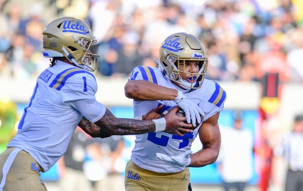 Dorian Thompson-Robinson Hands The Ball Off To Zach Charbonnet. Photo Credit: UCLA Athletics