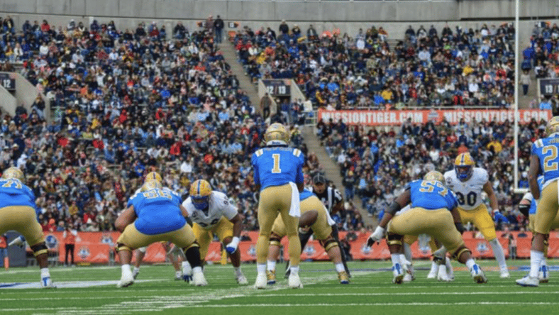 Bruins Offense lines up during UCLA Bowl Game Photo Credit: Shayne Smith